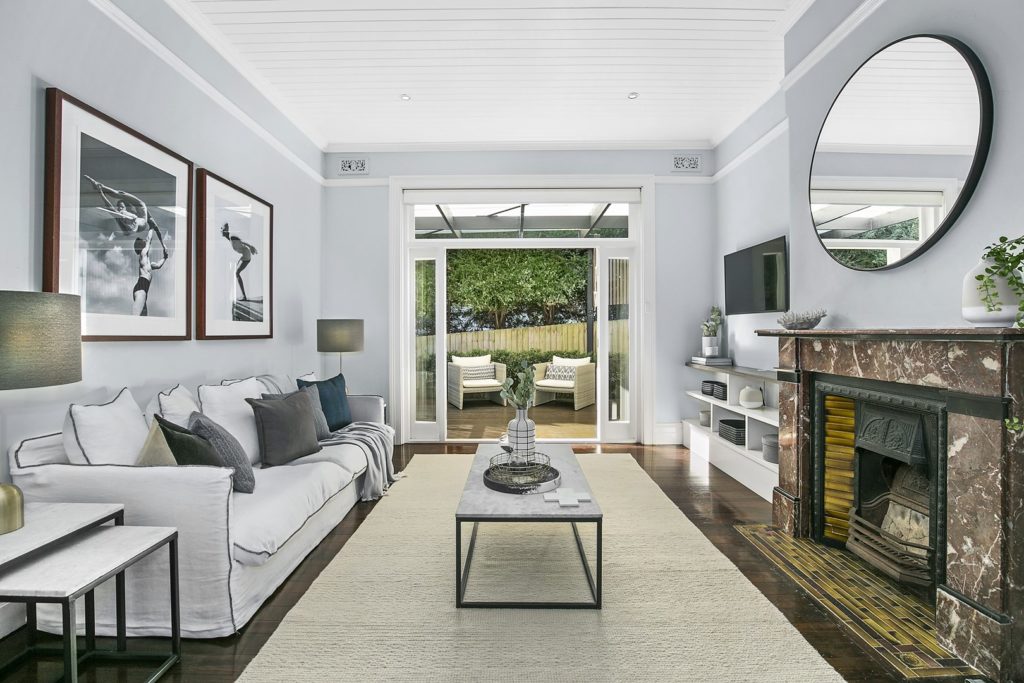 Gorgeous living area with orginal marble fireplace