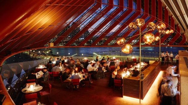 Dining under the sails of the Opera House, at Bennelong. Photo: Brett Stevens